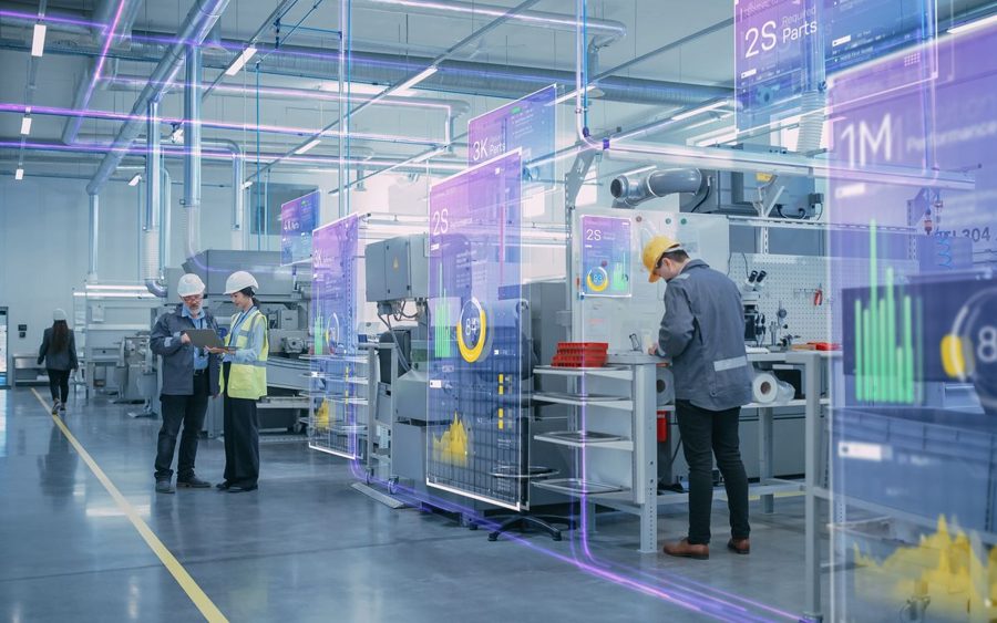 Engineers reviewing equipment data on the plant floor